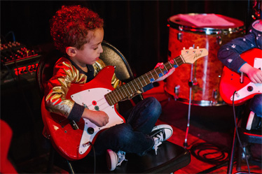 Kids playing music instruments